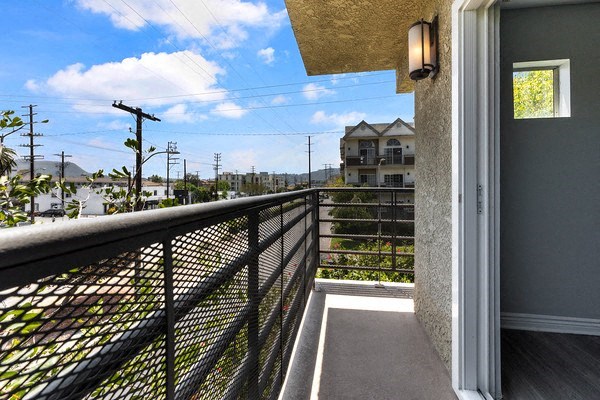 a balcony with a view of the street and buildings