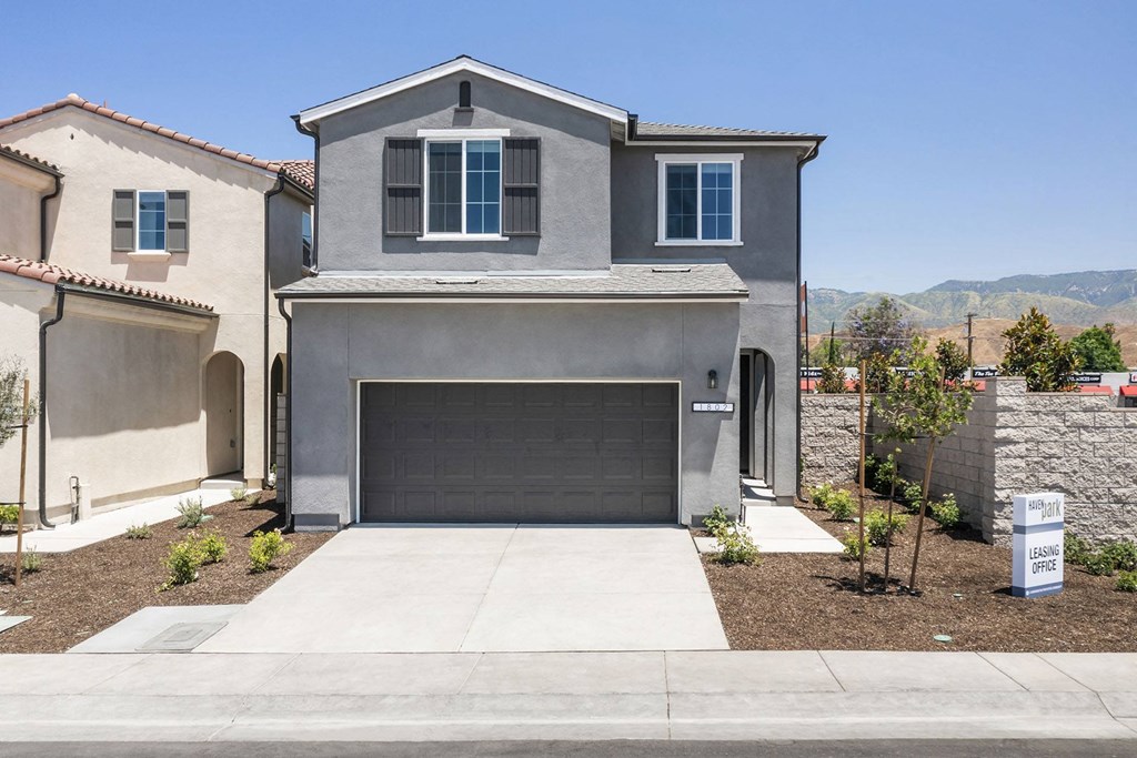a house with a driveway and a garage door
