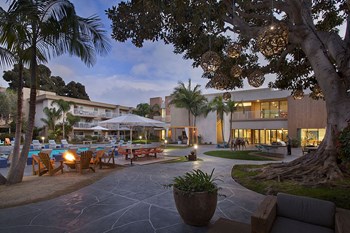 Apartments for Rent Coronado CA - Exterior View of the Apartment Building Showcasing Expansive Community and Gorgeous Landscaping - Photo Gallery 6