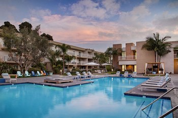 Coronado CA Apartments - Sparkling Pool Surrounded by Various Lounge Chairs Also Featuring a Gazebo - Photo Gallery 4