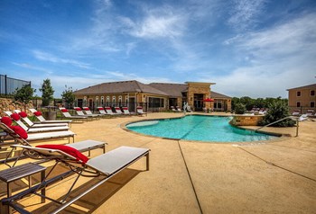 Pool with a row of lounge chairs - Photo Gallery 2