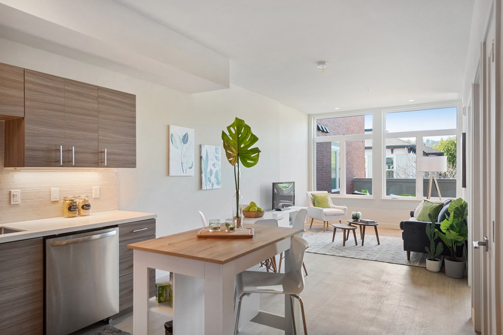 Open kitchen to the living room layout with over sized windows