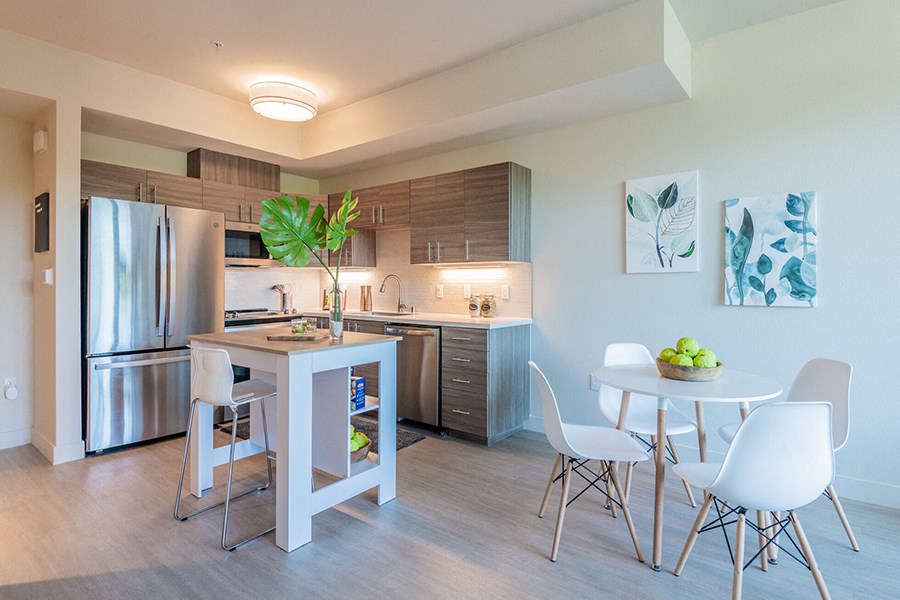 Kitchen area with full size stainless steel appliances
