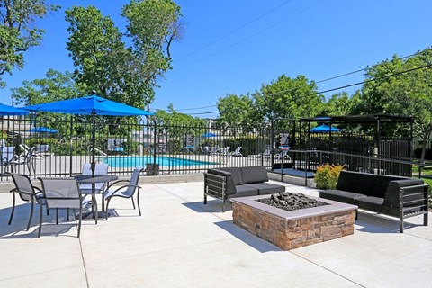 Pool area with fire pit and outdoor seating