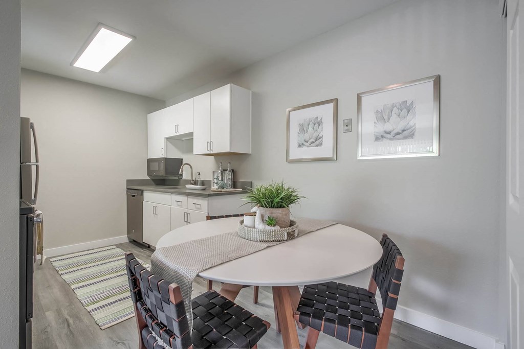 a kitchen and dining area with a table and chairs at Park Capitol, Salt Lake City, 84103