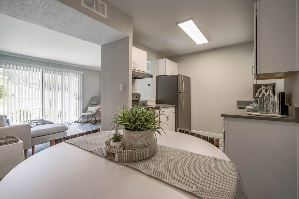 an open kitchen and living room with a white table at Park Capitol, Salt Lake City, UT