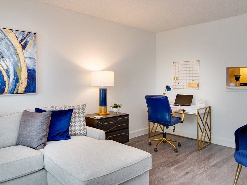 Living room with desk  Aqua 2800 Apartments in Oakland Park Florida