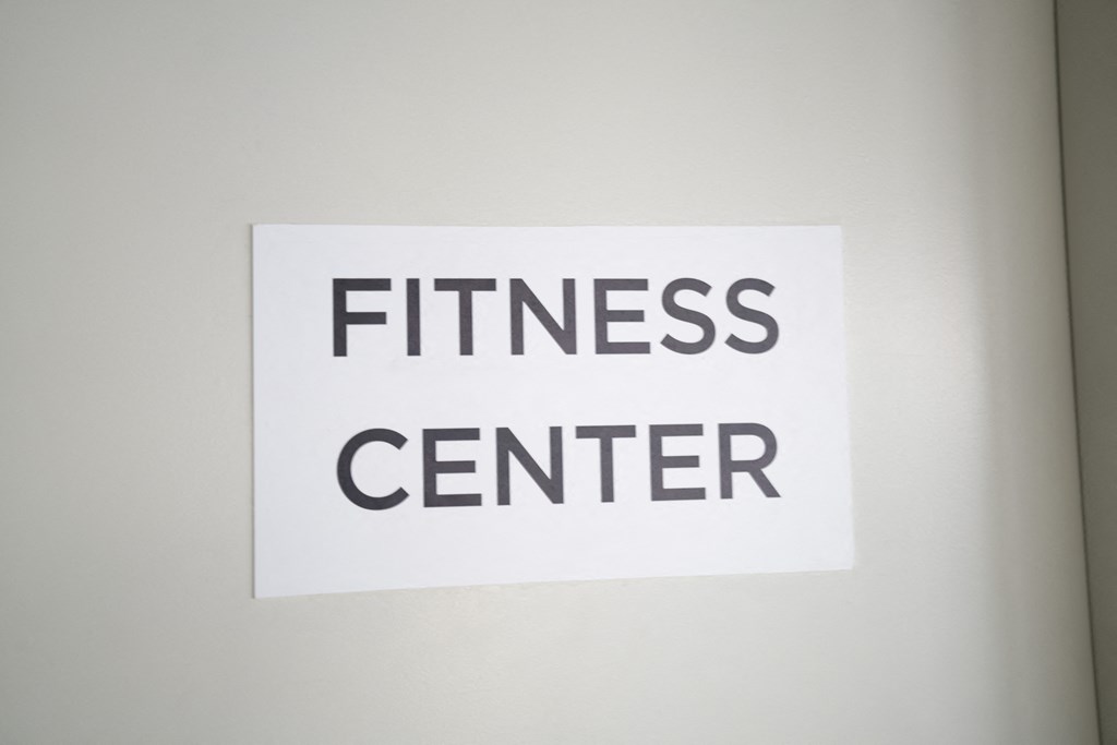 a white sign that reads fitness center on a white wall a white sign that reads fitness center on a white wall at Second & B Street, California, 94901