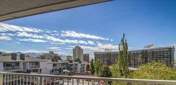 a balcony with a view of the city and mountains at Park Capitol, Salt Lake City Utah