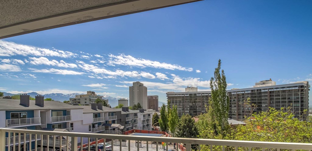 a balcony with a view of the city and mountains at Park Capitol, Salt Lake City, UT
