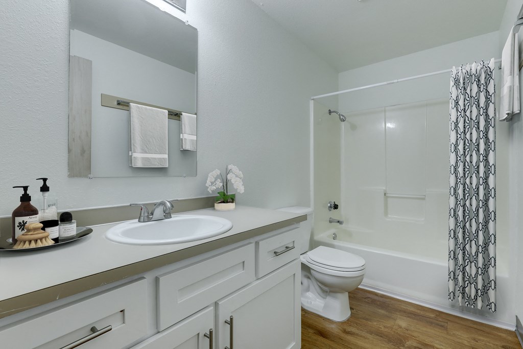 Towncenter apartments Bathroom with sink mirror and tub/shower