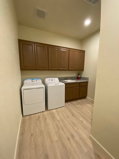 Full size washer and dryer in laundry area