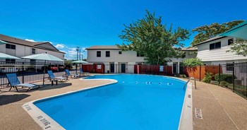 Pool with seating near building - Photo Gallery 5