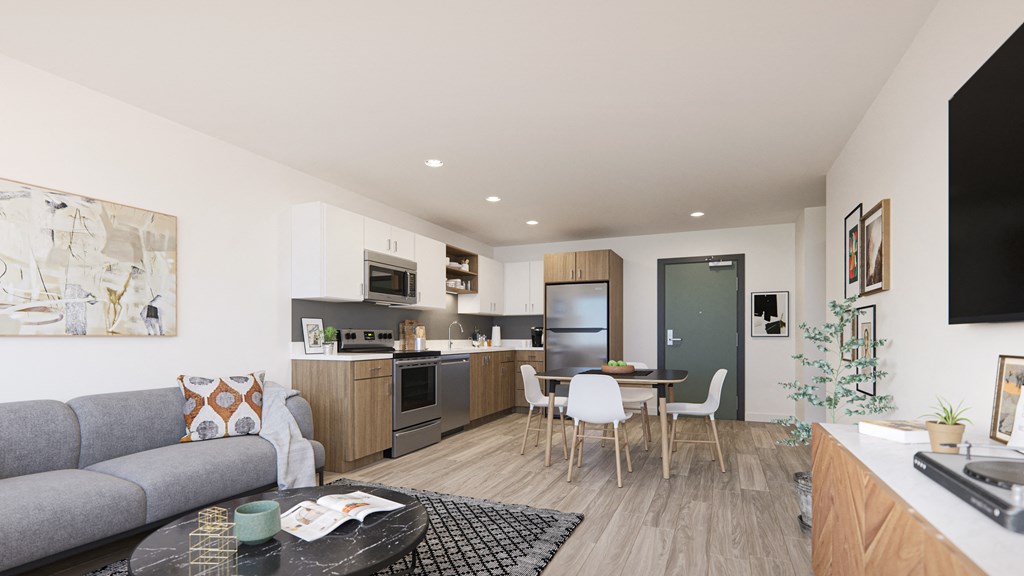 Pet-Friendly Apartments in Downtown Sacramento, CA - Mod at Midtown - Open Concept Living Area with Plank Wood Flooring, View of Modern Two-Tone Kitchen with Stainless Steel Appliances and Quartz Countertops
