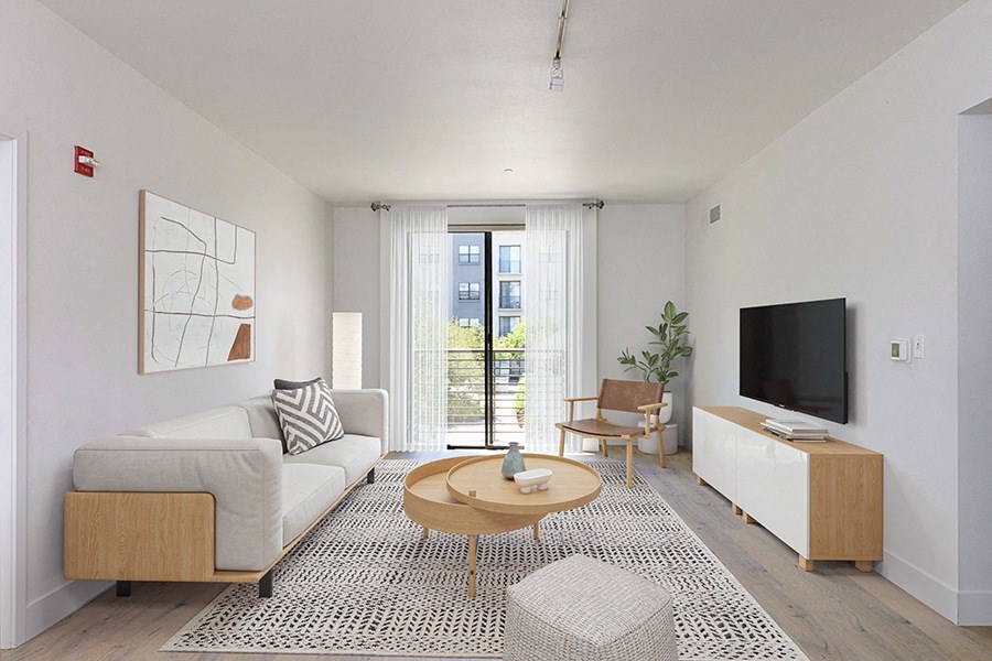 Apartments for Rent in Midtown Sacramento, CA - 1801L - Well Lit Living Room with Wood Style Flooring, Patio, Floor Rug, and Modern Furniture