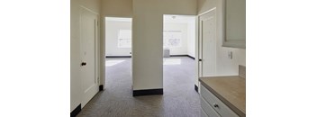 an empty room with a doorway leading into another room at MILEPOST 5 Apartments, PORTLAND
