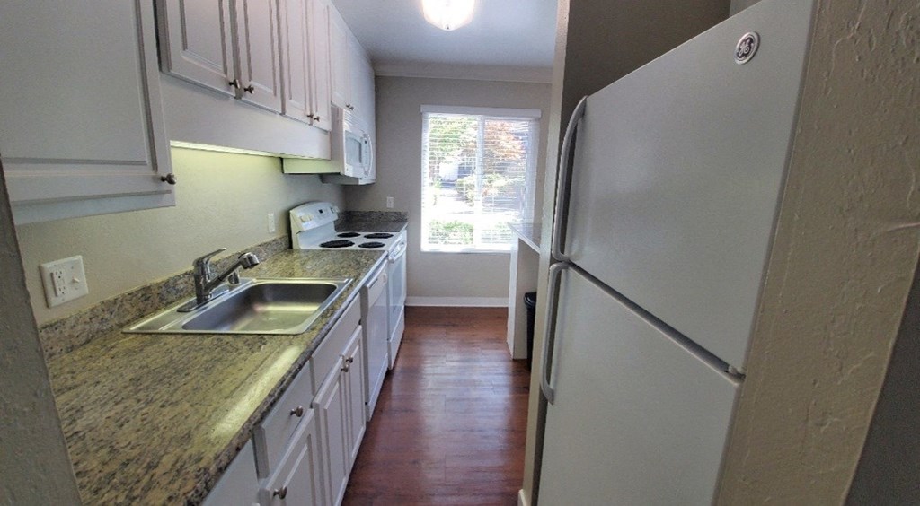 Walnut Creek CA Apartments - The Meridian - Kitchen with Modern Appliances and Granite-Style Countertops
