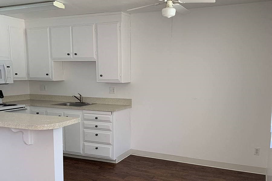 Renovated kitchen with white cabinets
