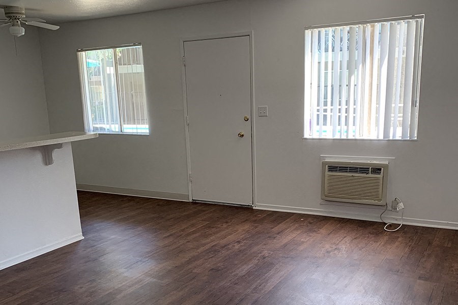 Living room with windows and wood floors