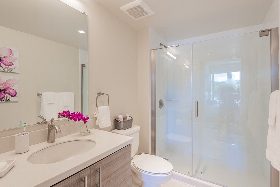 Full size bathroom with tub and vanity