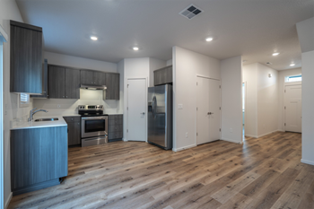 Spacious kitchens with natural lighting and full size stainless steel appliances - Photo Gallery 3