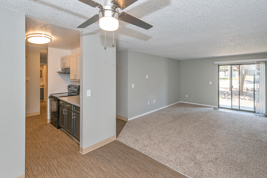 Apartments for Rent Federal Way, WA - Open-Concept Dining Room with Wood Flooring, Ceiling Fan, and Access to Living Room