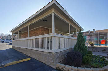 The Evergreens exterior showing the pool and parking - Photo Gallery 3