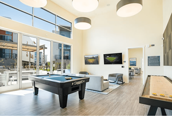 Hub Apartments in Folsom CA resident game room with pool  table and TVs