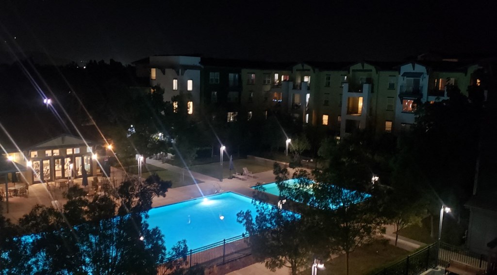 the view of the pool at night from our hotel room