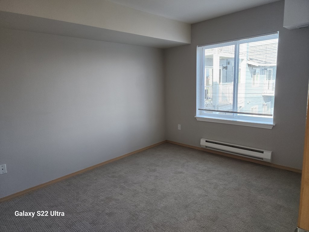 A room with a window and a wall-mounted air conditioner  at Everett Senior Community, Everett, 98201
