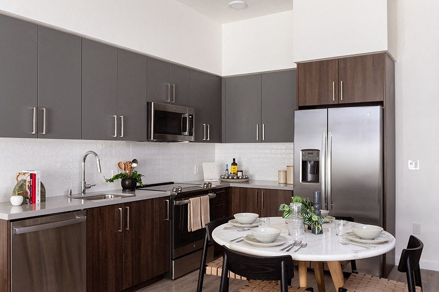 The Mansion kitchen area with dark cabinetry