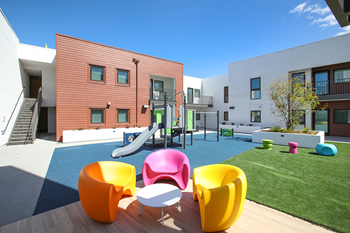 Courtyard space with seating and playground - Photo Gallery 3