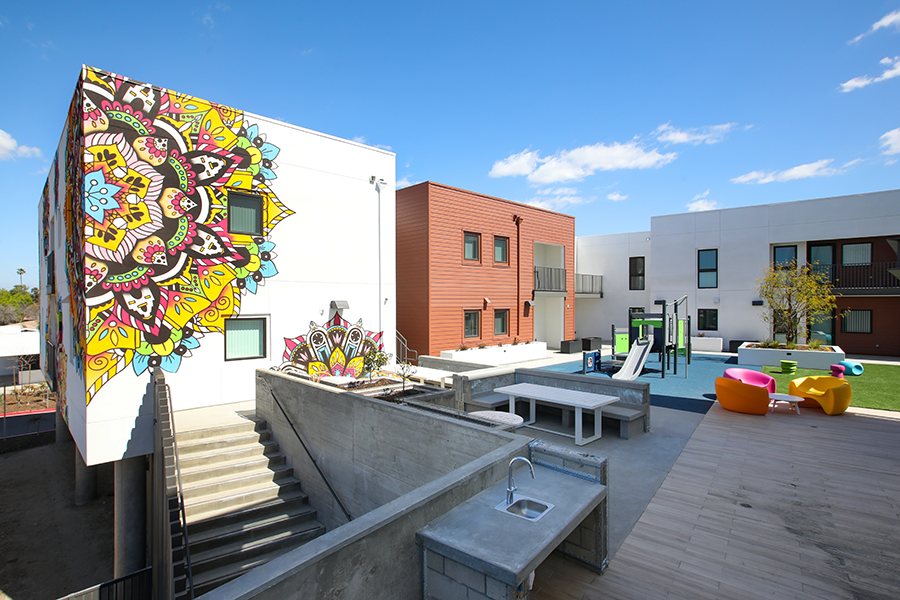 Courtyard with mural and seating area