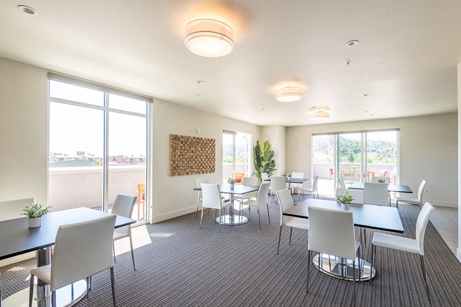 Top floor resident area with seating and city views