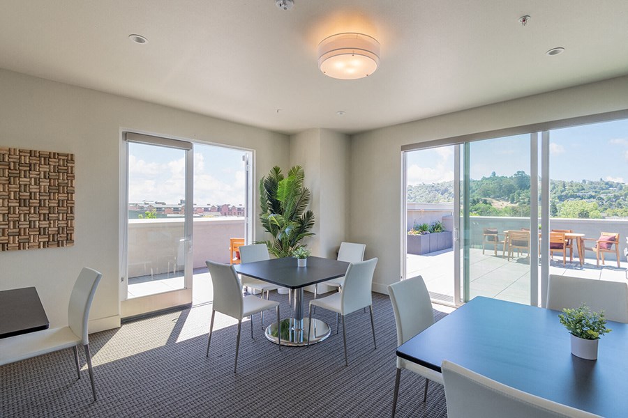 Top floor resident area with seating and city views