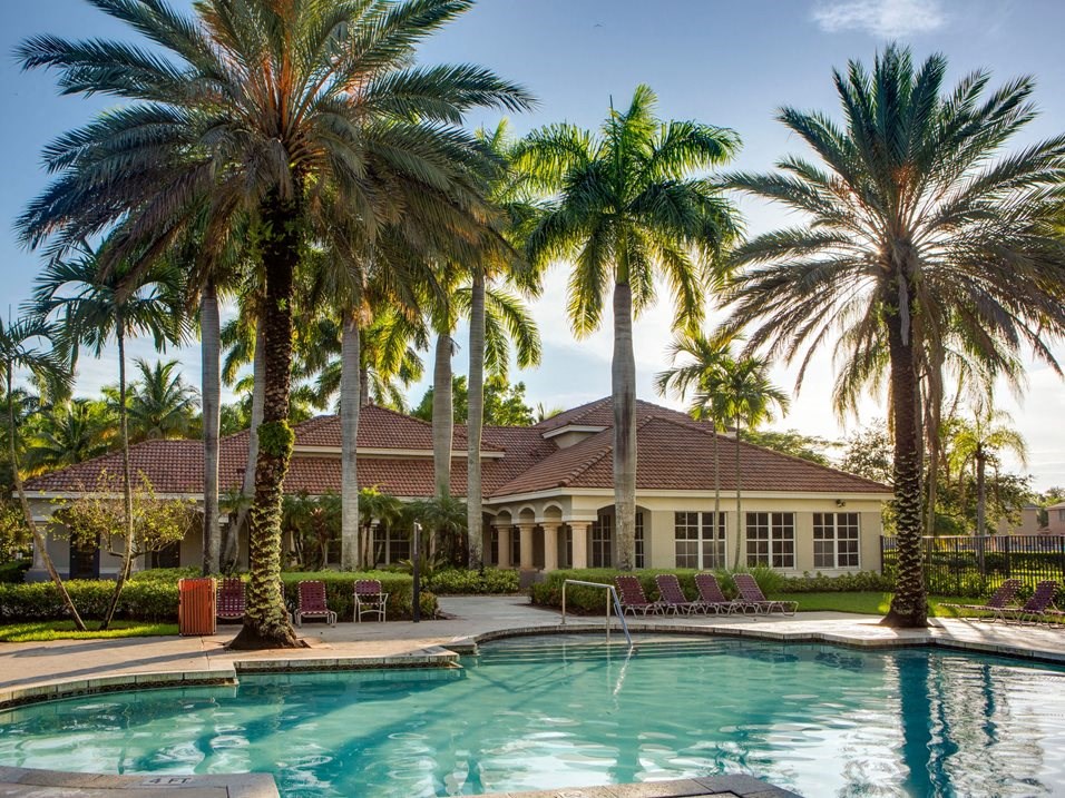 Pool with lounge chairs at Banyan Pointe, Florida, 33073