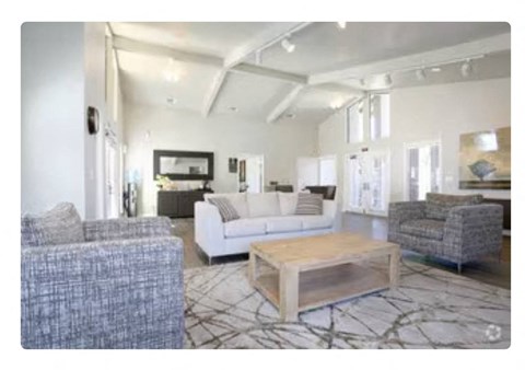 a living room with couches and a coffee table