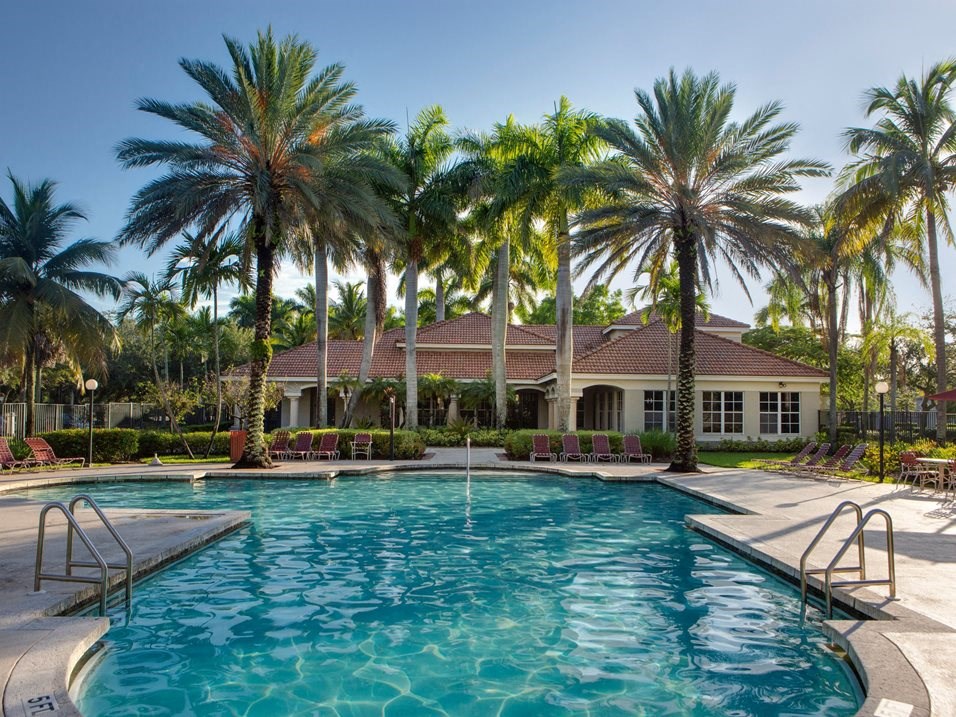 Pool with lounge chairs at Banyan Pointe, Florida 