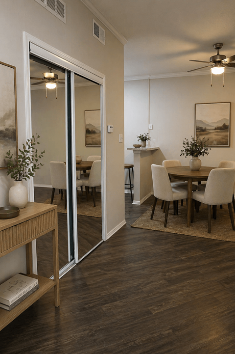 A modern dining room with a wooden floor and a glass door leading to another room at GEORGETOWN PARK, Georgetown