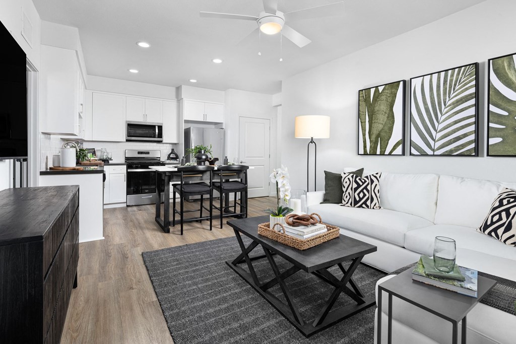 a living room with a white couch and a coffee table