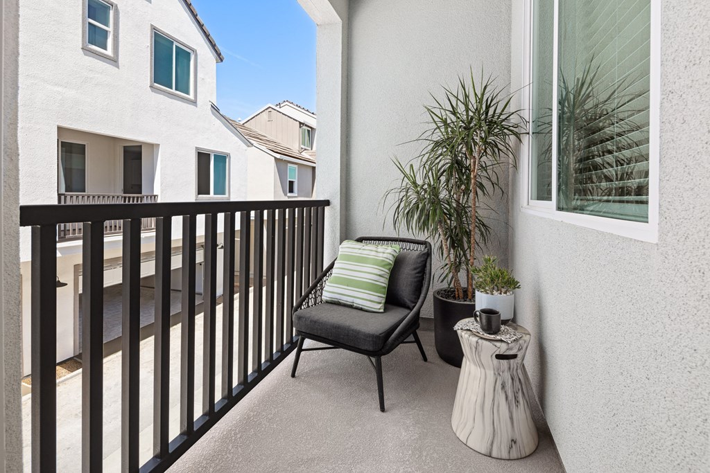 outside patio with grey chair and potted plant