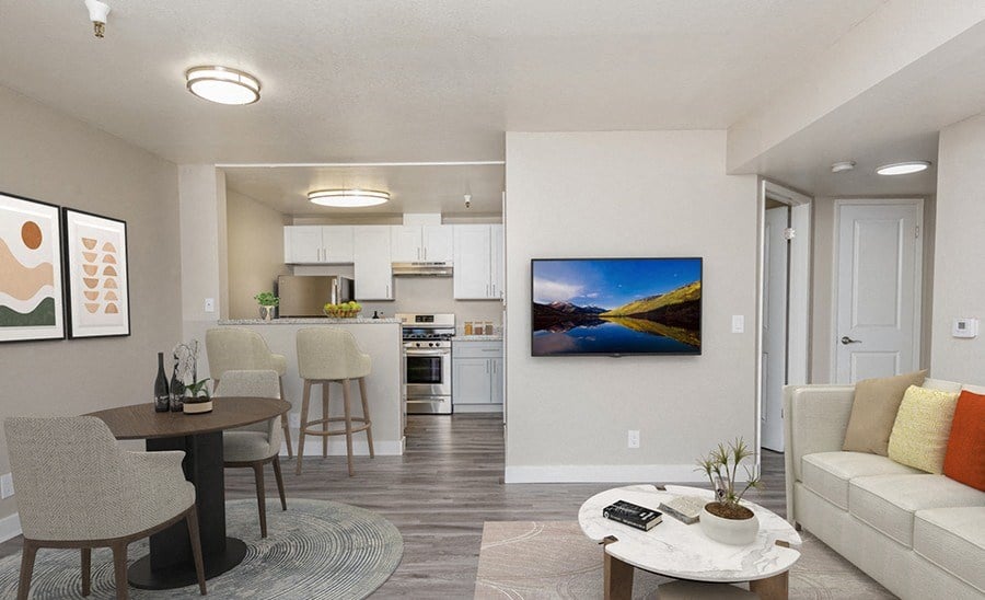 Furnished living area adjacent to breakfast bar and kitchen