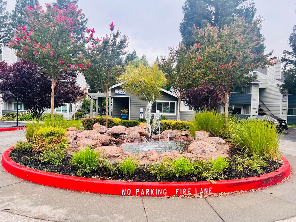 a no parking fire pit in front of a building