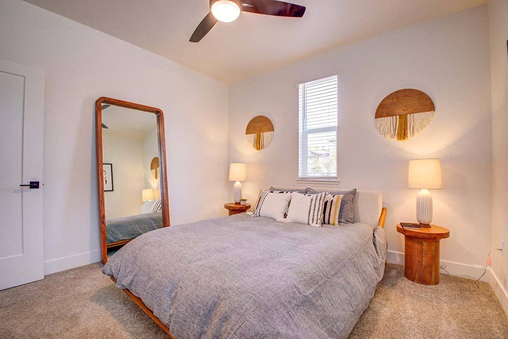Bedroom Apartments for Rent in Santa Rosa, CA - 38 North - Cozy Bedroom with Plush Carpeting, Large Window, and Queen Bed