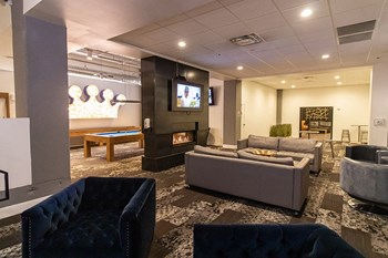 clubhouse with fireplace and seating and game area - Photo Gallery 5