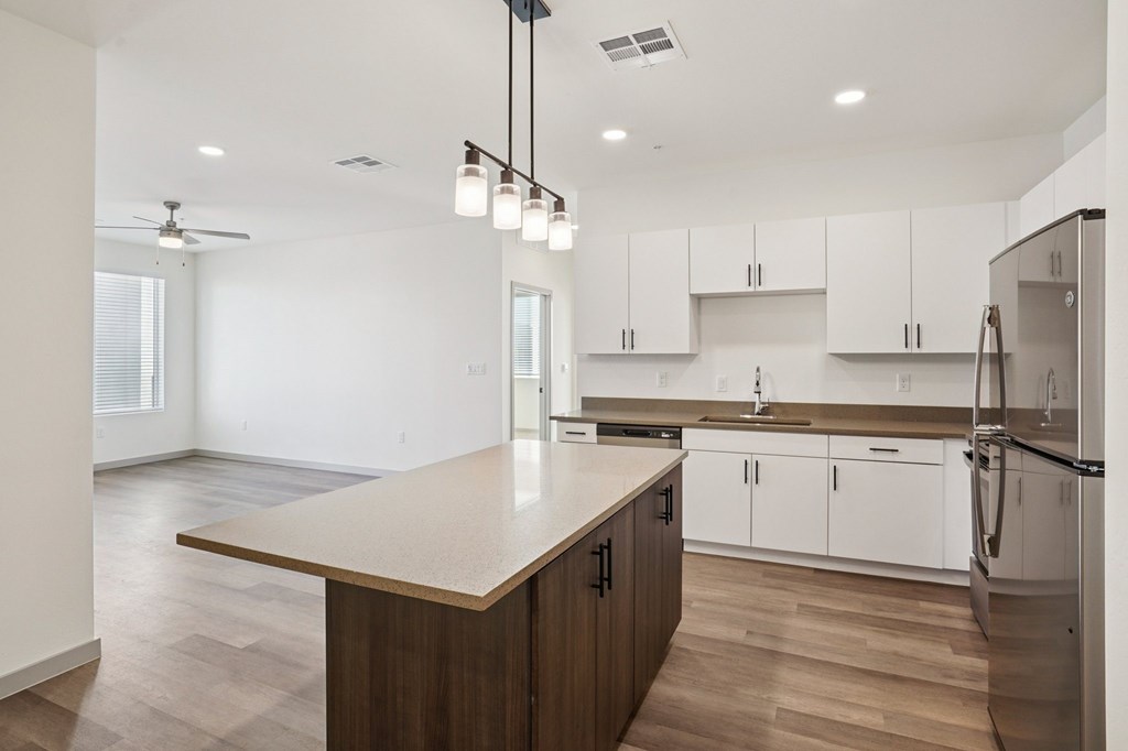 A kitchen with a wooden island and stainless steel appliances.at Cottonwood Ranch, Arizona