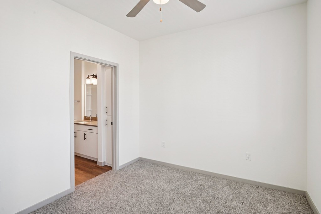 A room with a ceiling fan and a carpeted floor.at Cottonwood Ranch, Casa Grande, 85122