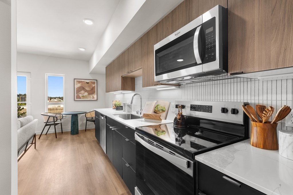 A modern kitchen with a black and white color scheme at Two 10 by Vintage, Washington