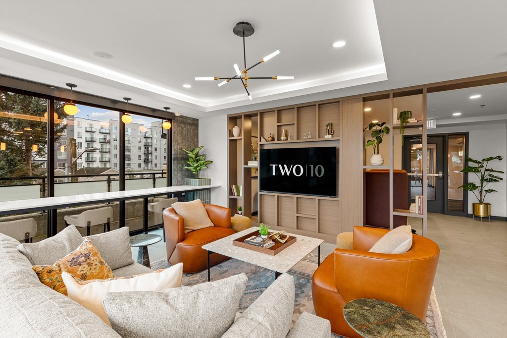 A living room with a couch, chairs, and a coffee table at Two 10 by Vintage, Shoreline, WA