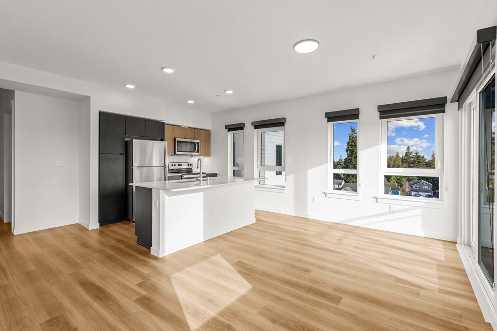 A kitchen with a refrigerator, microwave, and oven at Two 10 by Vintage, Washington